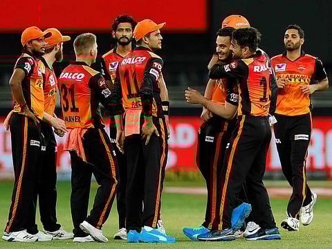 Sunrisers Hyderabad players celebrate the fall of a Chennai Super Kings' wicket in Match 14 of IPL 2020 at the Dubai International Stadium on October 3, 2020.