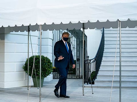 US President Donald Trump departs the White House in Washington en route to Walter Reed National Military Medical Center in Bethesda, Md. where he will be treated for the coronavirus.