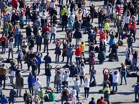 People take part in a protest against masks and virus restrictions during the ongoing Covid-19 pandemic (novel coronavirus) in Konstanz, southern Germany, on October 4, 2020. (Photo by Sébastien Bozon / AFP)