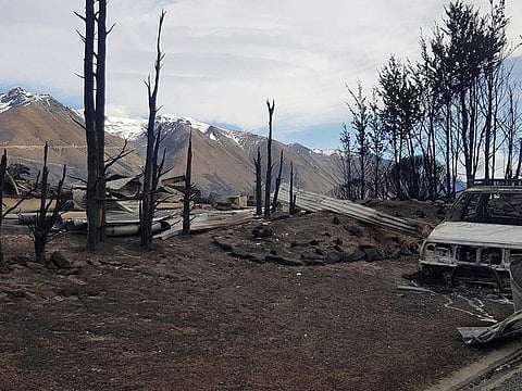 This handout photo taken and released on October 5, 2020 courtesy of Gary Kircher shows damage caused by the South Island wildfires in Lake Ohau.