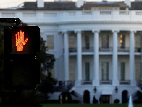 A traffic sign is seen near the White House.