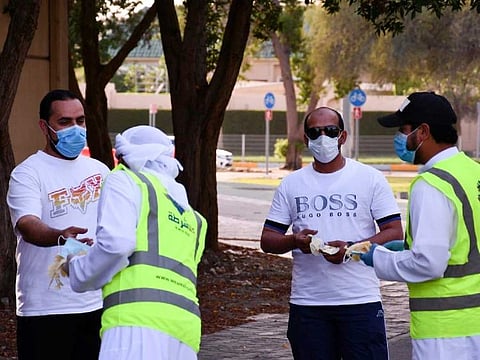 Community police officers wear a bright yellow vest to identify themselves.