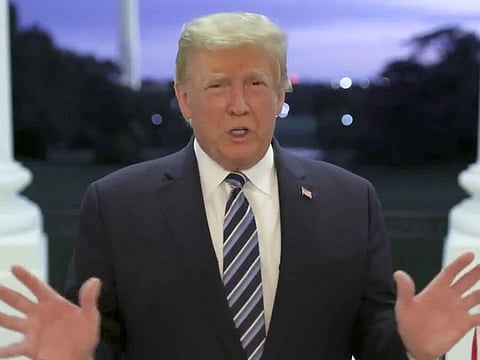 U.S. President Donald Trump speaks at the White House after returning from hospitalization at the Walter Reed Medical Center for coronavirus disease (COVID-19) treatment, in Washington, October 5, 2020, in this still image from video posted on Trump's Twitter page.