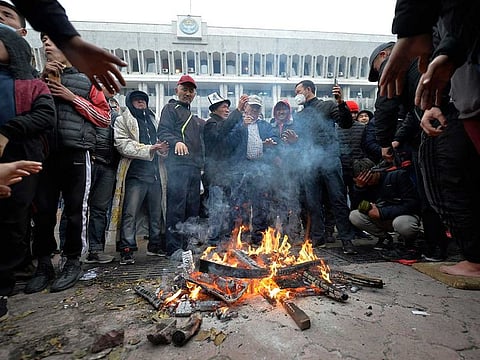 Protesters gather in front of the Kyrgyz government headquarters on the central square in Bishkek, Kyrgyzstan, Tuesday, Oct. 6, 2020.