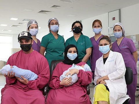 The premature Emirati twins at the time of discharge with NICU staff of Emirates Specialty Hospital