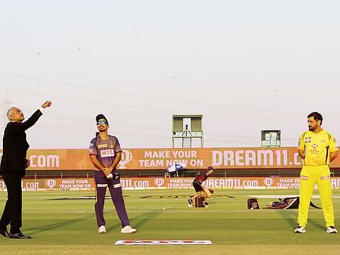 Kolkata Knight Riders' ex-skipper Dinesh Karthik and MS Dhoni of Chennai Super Kings during the toss at a IPL 2020 game at the Sheikh Zayed Stadium.