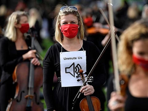 Musicians perform near the houses of Parliament during a protest highlighting their inability to perform live or work during the coronavirus disease (COVID-19) pandemic, London, Britain, October 6, 2020.