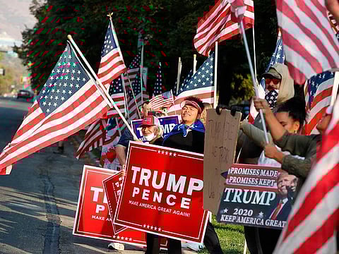 Supporters of US President Donald Trump show their support before the vice-presidential debate outside Kingsbury Hall at the University of Utah on October 7, 2020, in Salt Lake City, Utah.