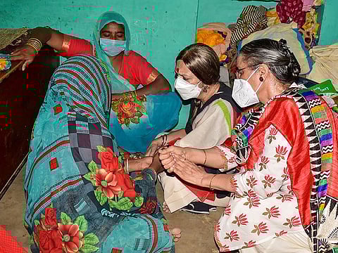 CPI(M) politburo member Brinda Karat meets the family members of a 19-year-old Dalit woman who died after being allegedly gang-raped, at Bulgadi village in Hathras, Tuesday, Oct. 6, 2020.