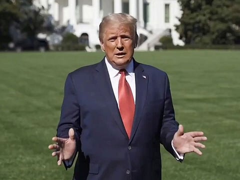 US President Donald Trump speaks outside the White House, where he is being treated for the coronavirus disease (COVID-19), in Washington, U.S. in this still image taken from social media video released on October 8, 2020.