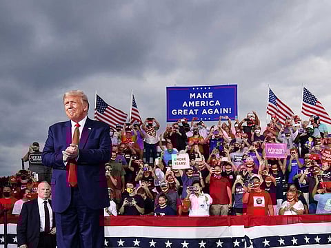 In this file photo taken on September 8, 2020 US President Donald Trump arrives for a campaign rally at Smith-Reynolds Regional Airport in Winston-Salem, North Carolina.