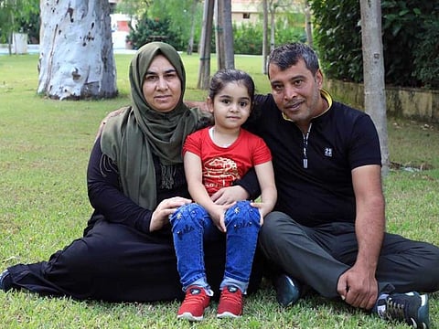 Sama with her parents