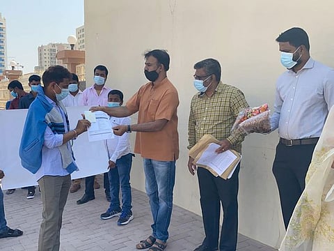 The stranded workers receive their documents to leave the UAE.