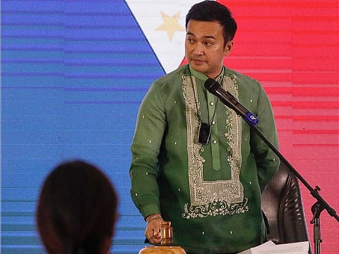 Representative Lord Allan Velasco bangs the gavel after being sworn in as new house speaker by supporters at the Celebrity sports club in Quezon city, Philippines.