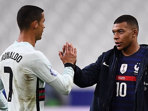 Cristiano Ronaldo of Portugal greets France's Kylian Mbappe after the 0-0 draw in Paris