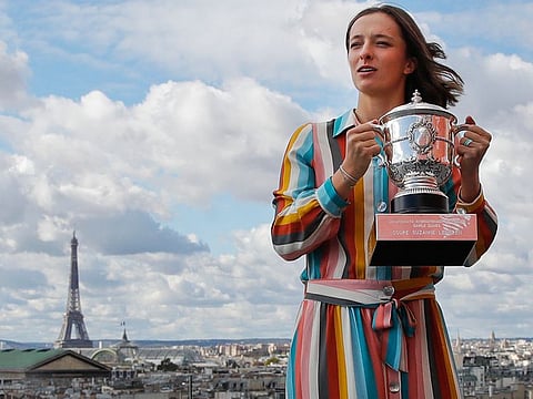 One for the album: Iga Swiatek poses with the Franch Open trophy in Paris last year.