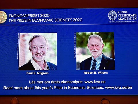 Pictures of the winners of the 2020 Nobel prize in economic sciences, Paul R. Milgrom and Robert B. Wilson, are displayed on a screen at a news conference in Stockholm, Sweden October 12, 2020.