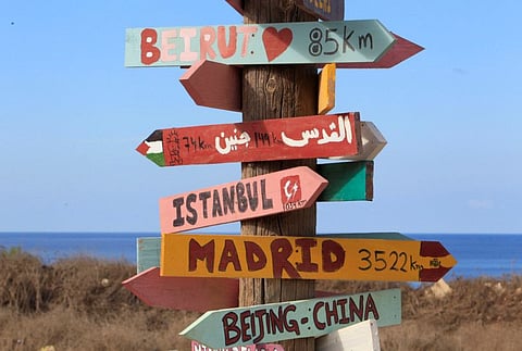 Signs bearing names of cities are pictured in Naqoura, near the Lebanese-Israeli border, southern Lebanon.