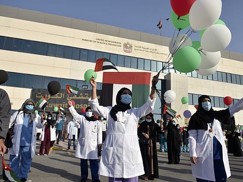 Staff at the Al Kuwait Hospital in Dubai celebrate before the UAE Air Force’s aerobatic display team fly over the hospital in an initiative of appreciation by the General Command of the UAE Armed Forces for the nation’s medical teams and staff. Photo for illustrative purpose only.Photo Clint Egbert/Gulf News
