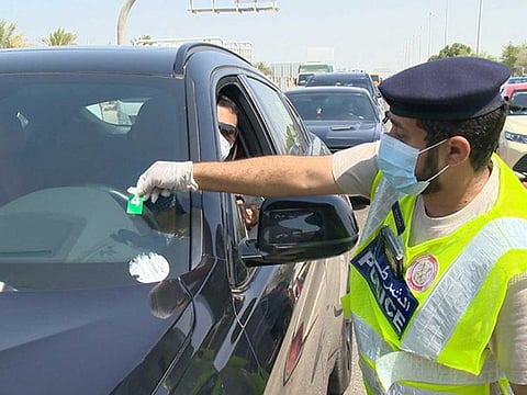 The Traffic and Patrols Directorate of Abu Dhabi Police are placing stickers with QR codes on vehicles entering the emirate as part of its road safety campaign.
