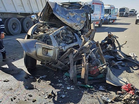 The mangled remains of the vehicle after the crash.
