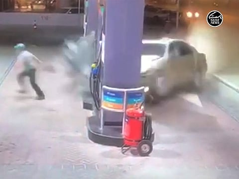 The speeding car suddenly veered off the road and crashed into the petrol pump.
