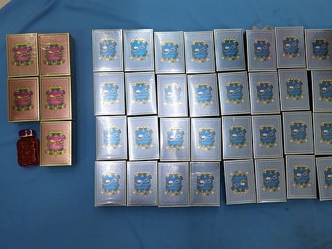 Two Asian men were caught trying to smuggle out 1.6 Kg gold worth Dh312,000 packed inside perfume bottles.