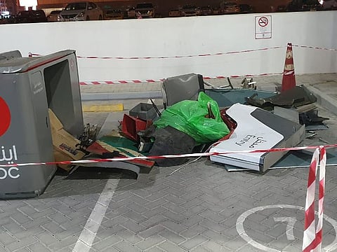 The fuel dispenser machine lies destroyed after the crash.