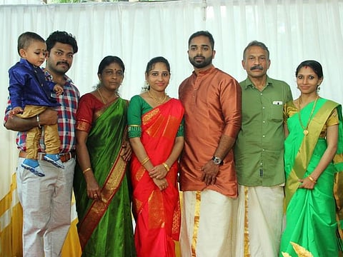 Cherikka Parambil Rajeevan (second from right) with his family during the wedding engagement of his daughter Anusree (third from left) and Sajayan (next to her) on February 7. Rajeevan’s wife Nishi (second from left), their two other children and a grandson are also seen.