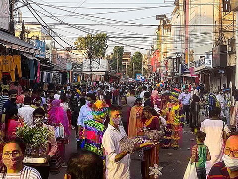 Shoppers crowd in a market area in New Delhi on October 18, 2020.