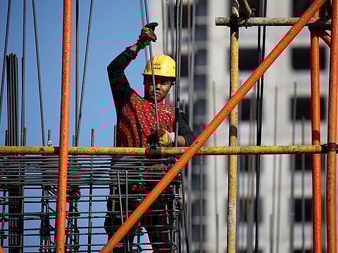 A construction worker in China. Officials have signaled concern about the real estate market, where home sales continue to decline.