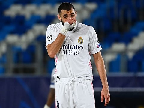 Real Madrid's French forward Karim Benzema reacts after the defeat to Shakhtar Donetsk.