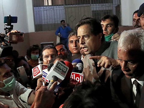 Mohammad Safdar, son-in-law of former Pakistani Prime Minister Nawaz Sharif, gestures as he speaks to journalists after a court granted him bail, outside a court in Karachi, Pakistan, Monday, Oct. 19, 2020. Pakistani police briefly detained Safdar accusing him of leading a crowd in a chant against the military at the tomb of the country's founder.