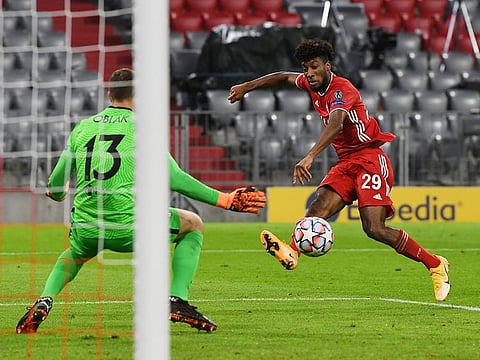 Bayern Munich forward Kingsley Coman (R) scores to make it 4-0.