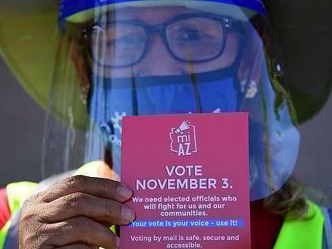 A lady in Phoenix, Arizona on October 15, 2020 encourages people to vote in the November 3 presidential and congressional elections