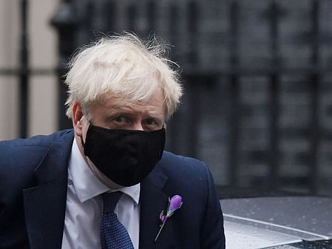 Britain's Prime Minister Boris Johnson returns to Downing Street from the Houses of Parliament in London