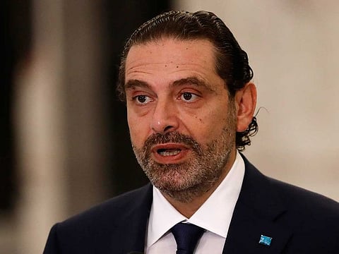 Lebanese Prime Minister-Designate Saad Hariri speaks to journalists at the Presidential Palace in Baabda, east of Beirut, Lebanon, Thursday, Oct, 22, 2020. Lebanon's president Michel Aoun asked former premier Saad Hariri to form the country's next government Thursday after he secured enough votes from lawmakers - bringing back an old name to lead the country out of its dire political and economic crises.