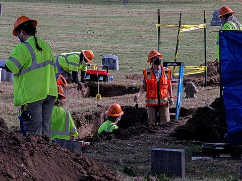 Excavation crews search Oaklawn Cemetery in Tulsa, Okla., for remains from the city’s 1921 race massacre, Oct. 21, 2020.
