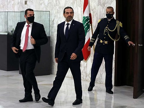 Lebanese leader Saad Hariri, walks after being named Lebanon's new prime minister at the presidential palace in Baabda, Lebanon