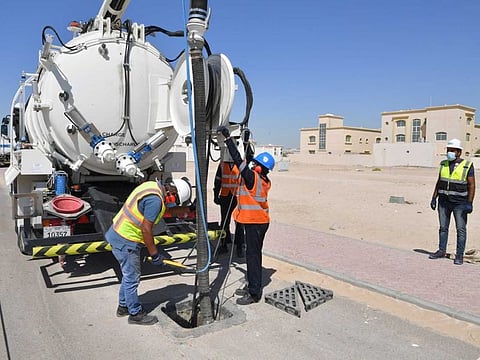 Working cleaning a rain water drain. Abu Dhabi Municipality says that preparations for upcoming rainy season have been completed.