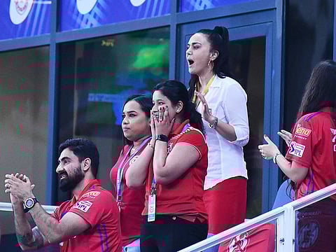 Kings XI Punjab  owner Priety Zinta (in white) cheers her team during the match.