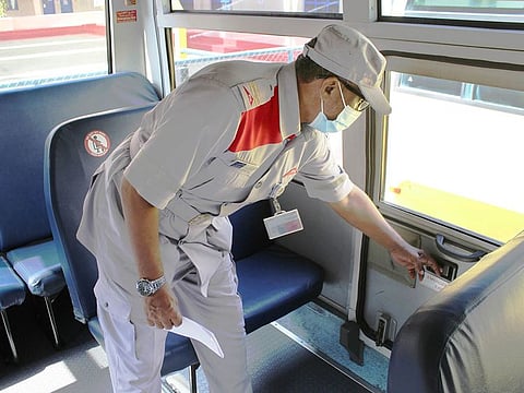 A school bus being checked for compliance with safety protocols