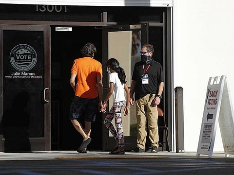Early voters cast their ballots at the Pinellas County Supervisor of Elections office polling station on October 25, 2020 in Largo, Florida.