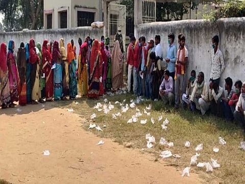Gloves used by voters strewn outside a polling booth in Bihar.