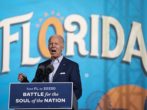 Democratic presidential nominee Joe Biden speaks during a drive-in campaign rally at the Florida State Fairgrounds on October 29, 2020 in Tampa, Florida.