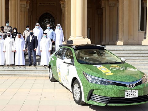Officials at the launch of the vehicles.
