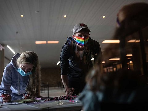 Texas State University students register to vote in Hays County during a National Voter Registration Day event on campus in San Marcos, Texas, on Sept. 22.