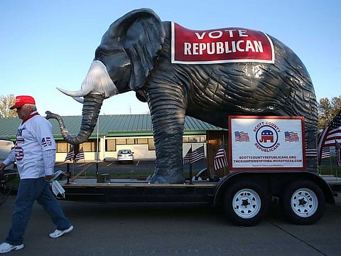 An elephant wearing a face mask is displayed outside a campaign event for Senate candidate Sen. Joni Ernst (R-IA) at Dahl Auto Museum, as part of her RV tour of Iowa, on October 31, 2020 in Davenport, Iowa.