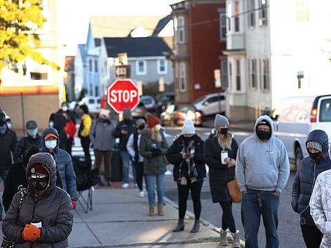 People wait in line to vote on November 03, 2020 in Portland, Maine.
