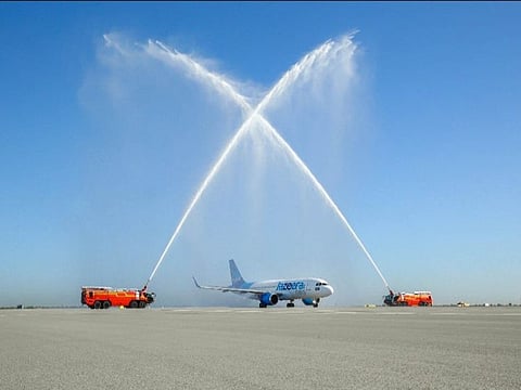 Water sprinklers welcome the Jazeera Airways plane in Muscat.